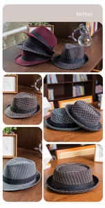 Close-up of British style plaid wool felt fedora with decorative black ribbon band