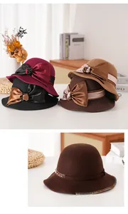 Dettaglio cappello cloche in feltro di lana con fiocco in seta e bordo intrecciato