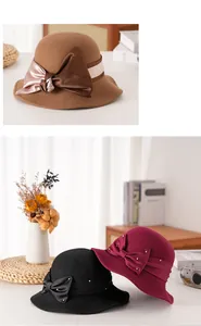 Dettaglio del cappello cloche in lana con elegante fiocco di raso e perline argentate