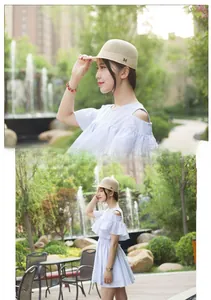 Detail of light beige breathable mesh sun hat with black letter M embroidery