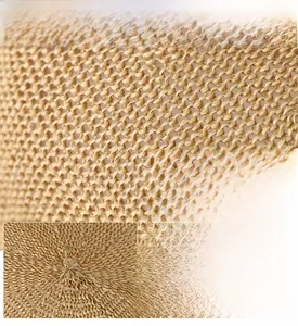 Close-up of fine linen weave on a beige ivy cap showing breathable mesh texture