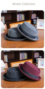 Detailed close-up of winter vintage plaid fedora hats with black grosgrain ribbon bands
