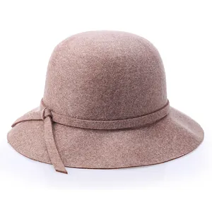Elegant mauve wool felt dome hat with wavy brim and side knot for stylish women's winter wear