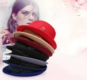 Detailed stack of multi-colored wool fedora hats featuring elegant printed ribbons