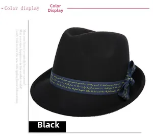 Detail of black wool felt fedora featuring a blue silk ribbon with elegant gold script