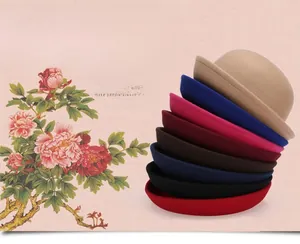Stack of elegant wool felt bowler hats for women in eight vibrant autumn winter colors
