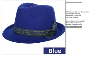 Detail of wool fedora hat with blue ribbon and elegant gold cursive typography