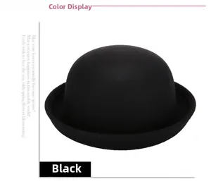 Detailed view of a classic black wool felt bowler hat featuring a smooth round top design