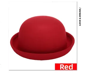 Detail view of a classic red wool bowler hat with soft lighting on a white background