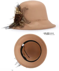 Detail view of khaki wool cloche hat featuring decorative mesh rose and inner sweatband