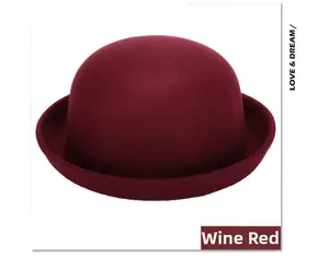 Detailed view of the wine red wool felt bowler hat with round brim and smooth texture