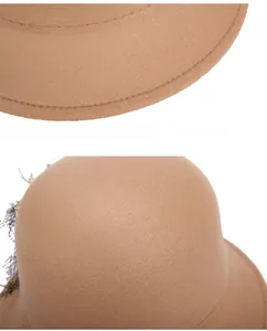 Detail of camel wool felt hat showing precision stitching and black mesh lace decoration