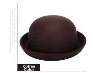 Detail view of the coffee brown wool felt bowler hat with a vintage rounded crown design
