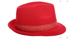 Detail of red wool fedora hat with gold script lettering on the ribbon band