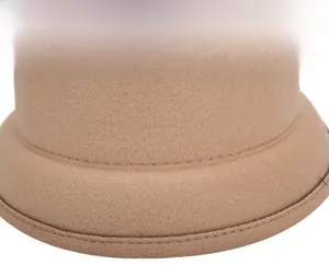 Detail view of precise stitching on camel wool felt fedora for women autumn winter