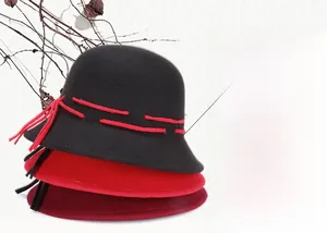 Vertical stack of stylish wool felt bowler hats in black, red, and burgundy colors