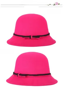 Front and side views of women's vintage wool cloche hat in vibrant rose red with black bow