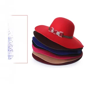 Detail showing various colors of wool fedora hats with crystal flower and ribbon accent