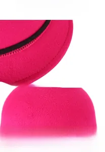 Close-up of precision stitching and fine felt texture on the brim of a fuchsia wool hat