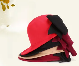 Detail showing wool felt equestrian hats with large bow accents in multiple autumn colors