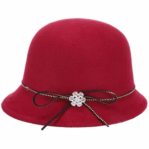 Elegant wine red wool felt cloche hat with rhinestone flower and gold-dotted trim