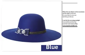 Detail of blue wool felt wide brim hat with silk bow and sparkling rhinestone accents
