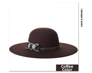 Detail of coffee wool fedora hat with black bow and rhinestone floral decoration
