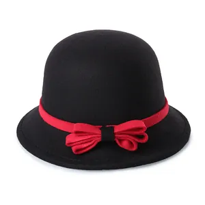 Classic black wool felt bowler hat with a vibrant red ribbon and elegant bow accent