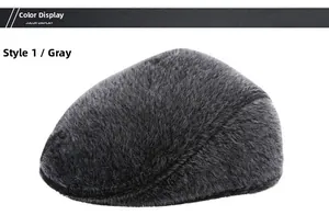 Close-up of deep grey plush thermal newsboy cap showing fluffy texture and warm fabric