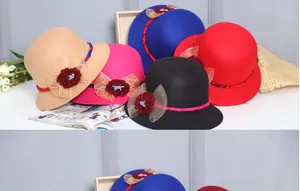 Detailed view of women's wool felt cloche hats featuring elegant floral mesh bow accents