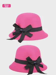 Detailed side and front view of a rose red felt bucket hat with a black bow ribbon