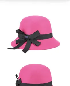 Detailed side view of a rose red wool felt cloche hat with a black satin bow ribbon
