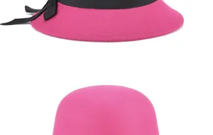Detailed close-up of rose red wool cloche hat with black ribbon and delicate bow accent