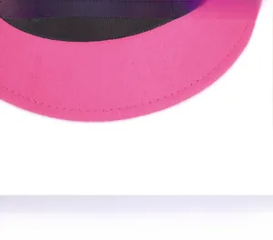 Close-up of pink wool hat brim showing fine stitching and black grosgrain inner band