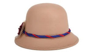 Detail of wool cloche hat showing khaki texture with red mesh flower and beaded center