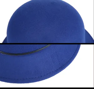 Close-up of royal blue wool fedora hat showing thick felt texture and black band detail
