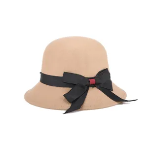 Elegant camel wool felt cloche hat for women with black ribbon bow and red accent