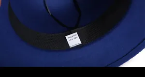 Detail view of navy wool fedora interior featuring black grosgrain sweatband and size tag