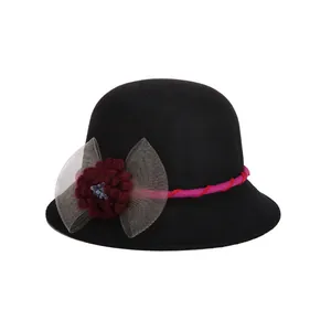 Elegant black wool cloche hat for women featuring a red floral bow and warm lining