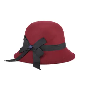 Elegant burgundy wool cloche hat for women with a black ribbon bow and a narrow brim