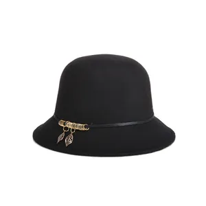 Elegant black wool cloche hat for women with golden leaf pendants and leather trim