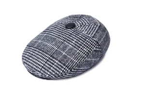 Detailed top view of men's houndstooth flat cap with textured grey fabric and button