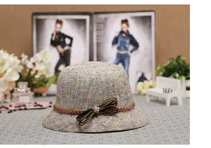 Trama dettagliata del cappello da sole in tweed da donna con fiocco elegante e strass