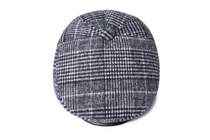 Top view of classic houndstooth flat cap with button detail for winter warmth