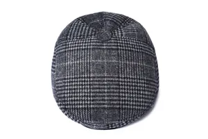 Close-up of classic dark grey plaid pattern and fabric texture on a flat cap