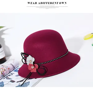 Close-up of wine red wool fedora featuring 3D floral accents and elegant rhinestone trim