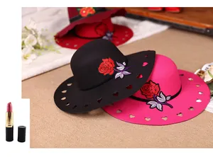 Detail of wide brim wool fedora with rose embroidery and heart-shaped hollow-out edge