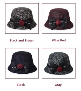 Detail view of four elegant wool felt bucket hats with silk bows and floral pearl accents