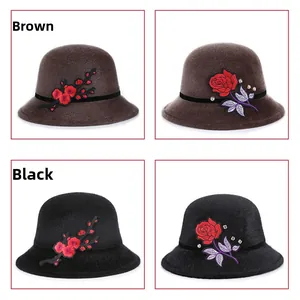 Detail of floral embroidery and rhinestone accents on warm faux fur winter hats
