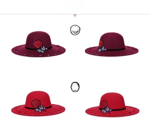 Detail of wool felt wide brim hat featuring rose embroidery and heart cutout patterns